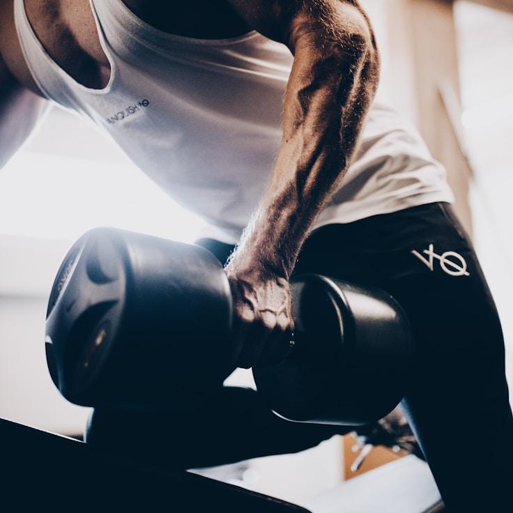 Women in a fitness class doing stretching and mobility exercises